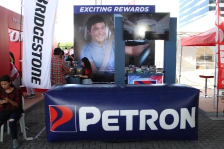 Petron booth besides the Bridgestone display area.