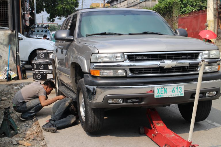 The Tahoe was driven for a short distance to load the suspension and then jacked up to adjust the front ride height.