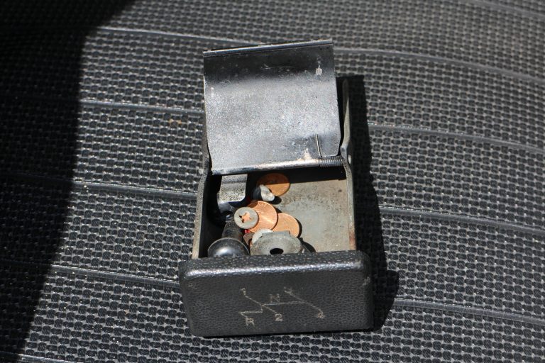 Wheel nut lock, windshield washer nipple, and lug nut lock key were in the ash tray.